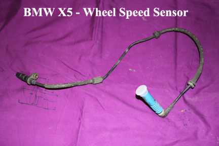 Shows BMW wheel speed sensor out of car.