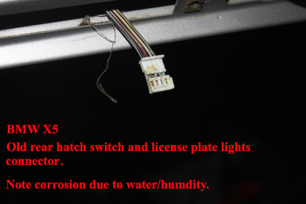 BMW X5 - Replacing the Rear Upper Hatch Switch - Wiring harness exposed.