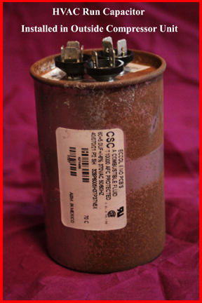 Shows bulging top of defective run capacitor on HVAC compressor unit.