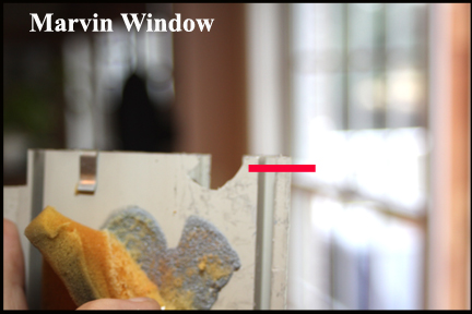 Marvin Wood Double Hung Windows - Shows Where Sash Tube Clip Has Broken Out Top of Vinyl Track