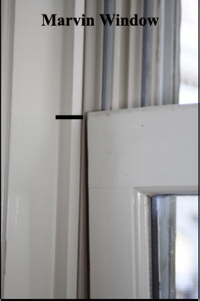 Marvin Wood Window - Pulling window past vinyl track