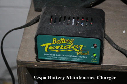 Shows Battery Tender Plus hooked to Vespa ET-4 battery.