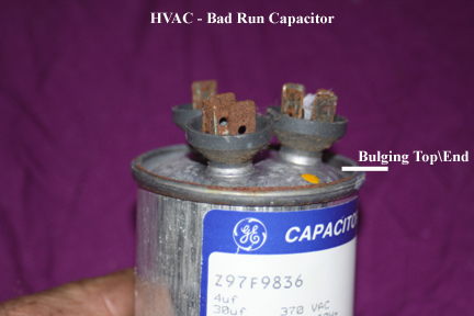 Shows bulging top of HVAC run capaitor: obvious fail mode.